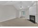 Living room featuring a fireplace and open layout at 240 Meadow Beauty Dr, Apex, NC 27539