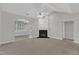 Living room featuring a fireplace and open layout at 240 Meadow Beauty Dr, Apex, NC 27539