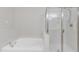 A close up of the separate jetted bathtub and glass shower in the main bathroom at 240 Meadow Beauty Dr, Apex, NC 27539