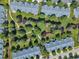 Aerial view of a residential neighborhood with well-maintained lawns and mature trees at 240 Meadow Beauty Dr, Apex, NC 27539