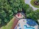 Overhead shot of the neighborhood playground with slide, climbing apparatus, and lounge seating nearby at 240 Meadow Beauty Dr, Apex, NC 27539