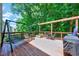 Relaxing outdoor space with a porch swing, chairs, and greenery, perfect for enjoying the surrounding nature at 2501 Springfield Park Dr, Raleigh, NC 27614