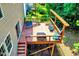 Elevated wooden deck with seating area, offering a serene outdoor space for relaxation and entertainment at 2501 Springfield Park Dr, Raleigh, NC 27614