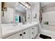 Bathroom with dual sinks, a full vanity, and shower and tub combo at 2501 Springfield Park Dr, Raleigh, NC 27614