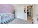 Charming bedroom featuring a crib and plenty of closet space at 2501 Springfield Park Dr, Raleigh, NC 27614