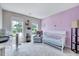 Cozy bedroom with lots of natural light, featuring soft, warm tones at 2501 Springfield Park Dr, Raleigh, NC 27614
