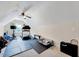 Light filled bonus room with exercise equipment, ceiling fan, and cozy dog bed at 2501 Springfield Park Dr, Raleigh, NC 27614