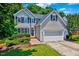 Charming two-story home with manicured lawn, attached two-car garage, and well-maintained landscaping at 2501 Springfield Park Dr, Raleigh, NC 27614