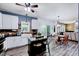 Open kitchen with a center island, stainless appliances, and seamless flow to a dining area and living space at 2501 Springfield Park Dr, Raleigh, NC 27614