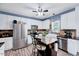 Modern kitchen featuring white cabinets, stainless steel appliances, and central island with seating at 2501 Springfield Park Dr, Raleigh, NC 27614