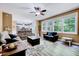 Spacious living room features natural light, neutral wall paint, hardwood flooring, and an open floor plan at 2501 Springfield Park Dr, Raleigh, NC 27614