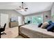 Well lit main bedroom featuring vaulted ceilings, a sitting area and an ensuite bathroom at 2501 Springfield Park Dr, Raleigh, NC 27614