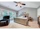 Relaxing main bedroom with a large bed, vaulted ceilings, and oversized windows at 2501 Springfield Park Dr, Raleigh, NC 27614