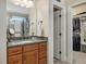 Bathroom featuring granite vanity and glass enclosed shower with walk-in closet at 259 Brown Bear, Chapel Hill, NC 27517