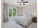 Comfortable bedroom with large window providing natural light and views of the backyard at 259 Brown Bear, Chapel Hill, NC 27517