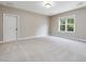 Carpeted bedroom featuring a window and large closet at 259 Brown Bear, Chapel Hill, NC 27517