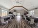 Large gathering space with tables, wood floors, TVs, an open layout, and recessed lighting at 259 Brown Bear, Chapel Hill, NC 27517