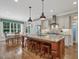 Bright kitchen features a large central island with seating, granite countertops, and stainless steel appliances at 259 Brown Bear, Chapel Hill, NC 27517