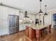 Spacious kitchen with stainless steel appliances, granite countertops, and a central island with seating at 259 Brown Bear, Chapel Hill, NC 27517