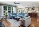 Open-concept living area featuring hardwood floors and a large window that provides natural light and backyard views at 259 Brown Bear, Chapel Hill, NC 27517