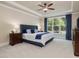 Serene main bedroom with tray ceiling, large window, and stylish blue accents at 259 Brown Bear, Chapel Hill, NC 27517