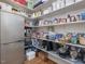 Walk-in pantry featuring ample shelving, organized storage, and a convenient refrigerator at 259 Brown Bear, Chapel Hill, NC 27517