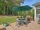 Cozy patio with outdoor seating and a grill, perfect for entertaining at 259 Brown Bear, Chapel Hill, NC 27517