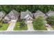 Overhead view of a well-manicured neighborhood featuring houses with neat lawns and driveways at 260 Easy Wind Ln, Garner, NC 27529