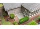 An aerial view of the backyard with a brick patio and green hedges surrounding the home at 260 Easy Wind Ln, Garner, NC 27529