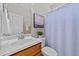 Cozy bathroom features light fixtures and a plant for a fresh touch at 260 Easy Wind Ln, Garner, NC 27529