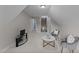 Bonus room features comfortable seating, a flat screen tv, and neutral colored walls at 260 Easy Wind Ln, Garner, NC 27529