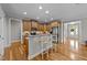 Kitchen with a breakfast bar, stainless steel appliances, and hardwood floors at 260 Easy Wind Ln, Garner, NC 27529