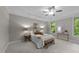 Main bedroom features large windows, a trey ceiling, a ceiling fan and plush carpeting at 260 Easy Wind Ln, Garner, NC 27529