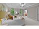 Main bedroom features large windows, trey ceiling, ensuite bathroom, and plush carpeting at 260 Easy Wind Ln, Garner, NC 27529