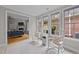 Sunroom features rocking chairs, an abundance of natural light, and access to the back yard at 260 Easy Wind Ln, Garner, NC 27529