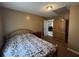 Inviting bedroom with view to adjacent room, featuring a wooden wardrobe at 2657 Joel Johnson Rd, Lillington, NC 27546