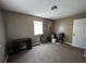 Neutral-toned bedroom with a window, suitable for customization and relaxation at 2657 Joel Johnson Rd, Lillington, NC 27546