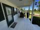 Covered front porch with a welcome mat and a charming porch swing at 2657 Joel Johnson Rd, Lillington, NC 27546