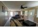 Spacious living room with comfortable seating and a ceiling fan at 2657 Joel Johnson Rd, Lillington, NC 27546