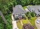 Expansive home featuring mature landscaping, large backyard and a long private driveway at 2725 Rosedale Ave, Raleigh, NC 27607
