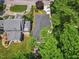 Stunning aerial view showing a well-maintained roof, mature trees, and lush green surroundings at 2725 Rosedale Ave, Raleigh, NC 27607