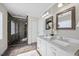 Bathroom with a modern shower, double sink vanity and sleek finishes at 2725 Rosedale Ave, Raleigh, NC 27607