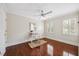 Bright bedroom with hardwood floors, fan and plantation shutters at 2725 Rosedale Ave, Raleigh, NC 27607