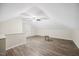 Spacious bonus room with new floors, modern light fixtures, neutral paint, and a vaulted ceiling at 2725 Rosedale Ave, Raleigh, NC 27607