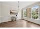 Bright dining room featuring hardwood floors, an elegant light fixture, and natural light at 2725 Rosedale Ave, Raleigh, NC 27607