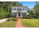 Charming two-story home featuring a classic facade, manicured lawn, and inviting entryway at 2725 Rosedale Ave, Raleigh, NC 27607