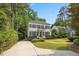 Beautiful two-story home with a well-maintained lawn, mature landscaping, and a welcoming entrance at 2725 Rosedale Ave, Raleigh, NC 27607