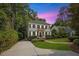 Charming two-story home featuring a landscaped yard, black shutters, and a welcoming entrance at 2725 Rosedale Ave, Raleigh, NC 27607