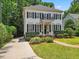 Traditional two story home with black shutters, tidy landscaping, and a curved driveway at 2725 Rosedale Ave, Raleigh, NC 27607