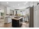 Well-appointed kitchen boasting stainless steel appliances, an island, and tiled backsplash at 2725 Rosedale Ave, Raleigh, NC 27607